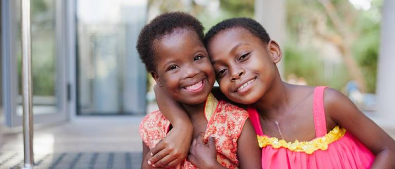 Image of two young girls smiling