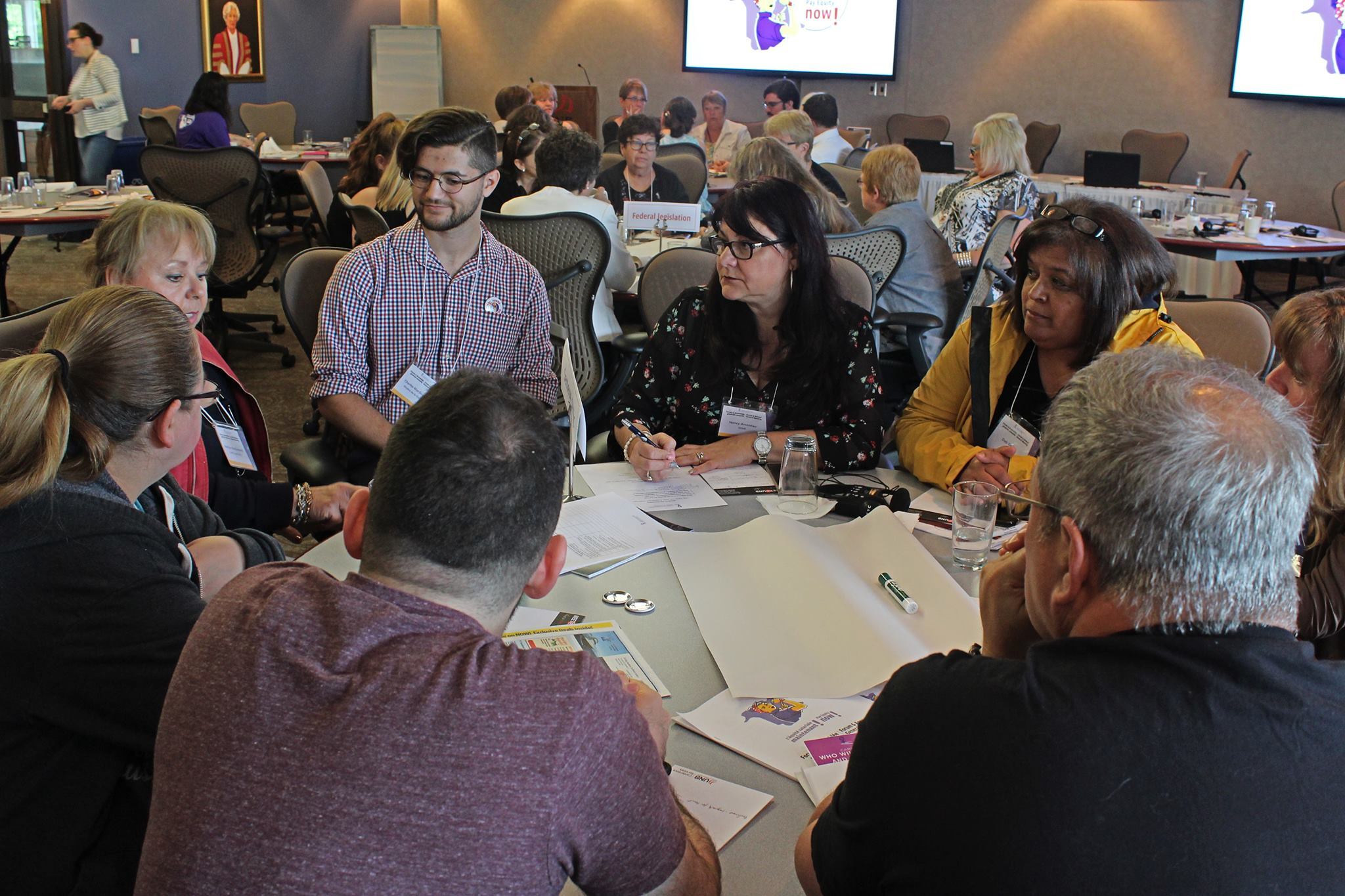 Photo: people sitting at a round table