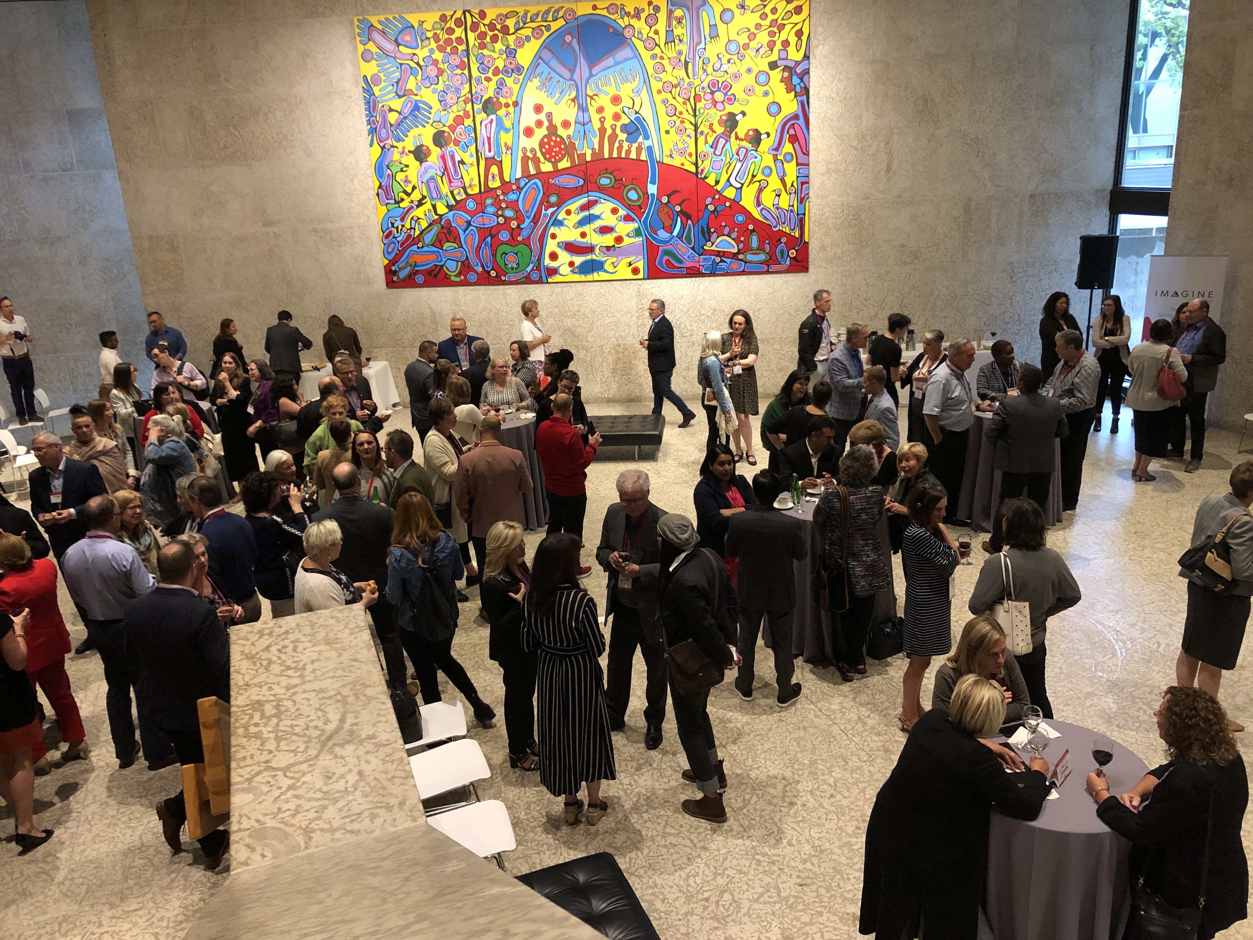 A group of people networking at the Winnipeg Art Gallery