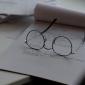 glasses resting on notepad